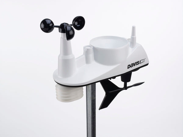 White wireless integrated sensor suite weather station by Davis Instruments with black wind cups on a silver pole.

