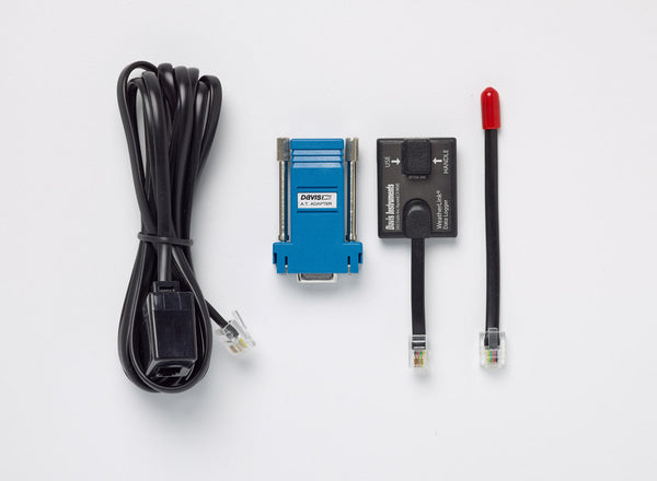 WeatherLink serial-port data logger by Davis Instruments with adapter, cables, and a red-tipped sensor.