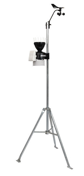 Weather station by Davis Instruments with wind vane, rain collector, and temperature sensors atop a galvanized tripod.
