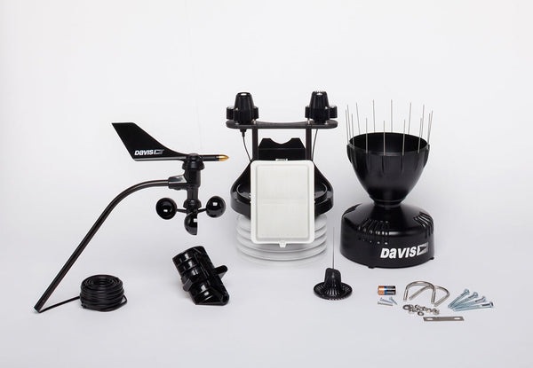 Black cabled Vantage Pro2 Plus Sensor Suite Weather Station by Davis Instruments, with solar panel, rain collector, and anemometer parts.