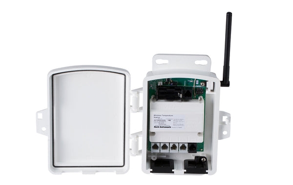 White wireless sensor transmitter by Davis Instruments with attached antenna, and ports along the bottom.