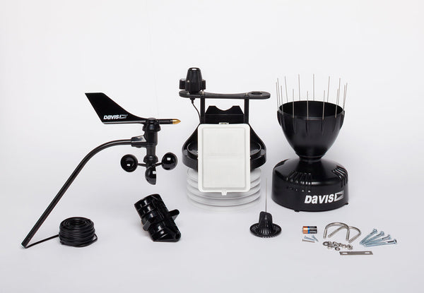Weather station sensor suite by Davis Instruments with wind vane, rain collector, and cabled sensor array.
