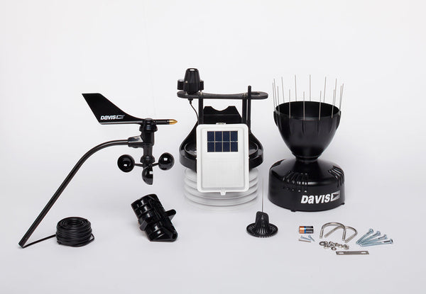 Black wireless sensor suite weather station by Davis Instruments, including a anemometer, rain collector, and solar power sensor.
